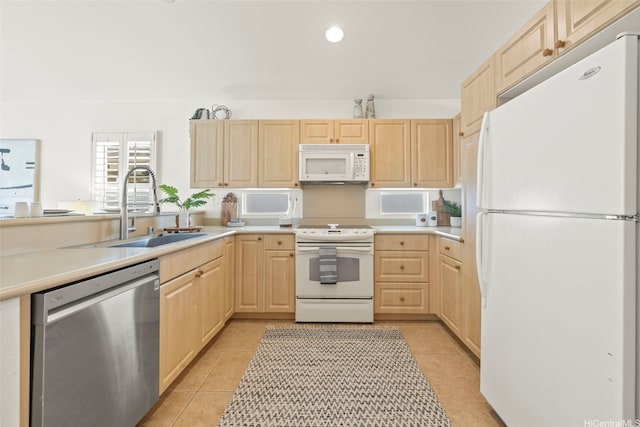 91-1023 Kai Weke St, Ewa Beach, HI 96706 - kitchen with light tile patterned flooring, light brown cabinets, white appliances, light countertops, and a sink