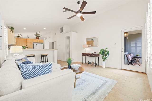91-1023 Kai Weke St, Ewa Beach, HI 96706 - living room featuring a ceiling fan, arched walkways, visible vents, and light tile patterned floors