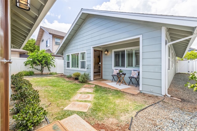 91-1023 Kai Weke St, Ewa Beach, HI 96706 - back of property featuring a fenced backyard, a gate, and a yard
