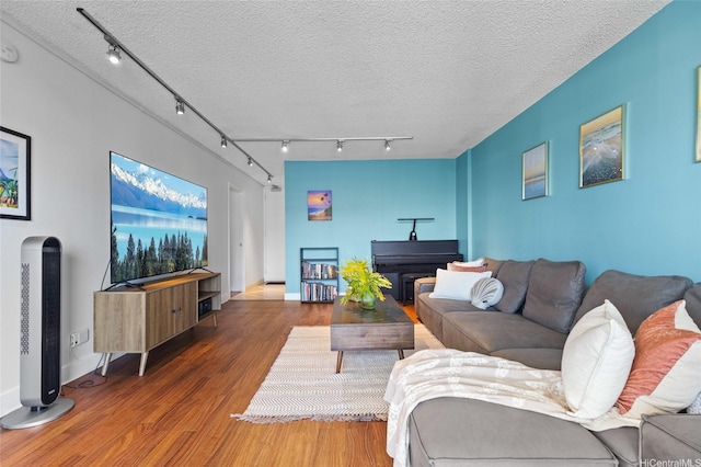927 Prospect St Unit 604, Honolulu, HI 96822 - living room with baseboards, a textured ceiling, track lighting, and wood finished floors
