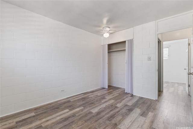 94-245 Leowahine St Unit 239, Waipahu, HI 96797 - unfurnished bedroom with a ceiling fan, a closet, and wood finished floors