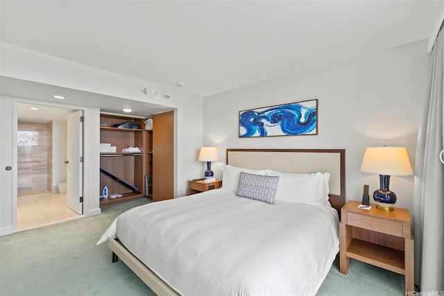 bedroom with carpet and ensuite bath