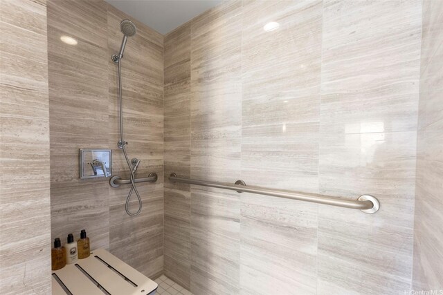 full bath featuring a tile shower