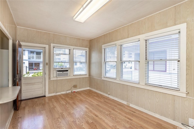 unfurnished sunroom with cooling unit