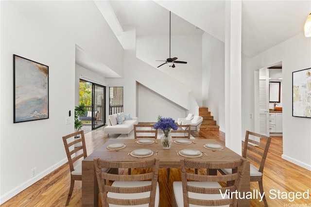 46-130 Kiowai St Unit 2724, Kaneohe, HI 96744 - dining area with light wood-style floors, baseboards, a ceiling fan, and stairs