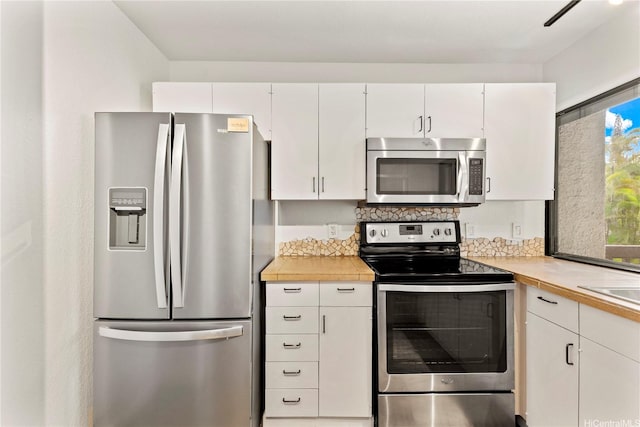 46-130 Kiowai St Unit 2724, Kaneohe, HI 96744 - kitchen with light countertops, white cabinetry, and appliances with stainless steel finishes