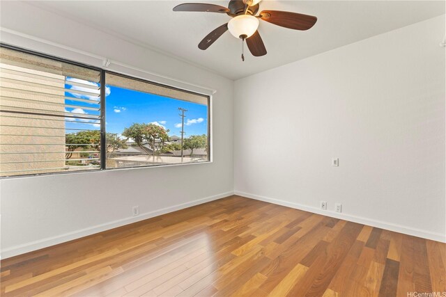 46-130 Kiowai St Unit 2724, Kaneohe, HI 96744 - empty room with baseboards, a ceiling fan, and wood finished floors