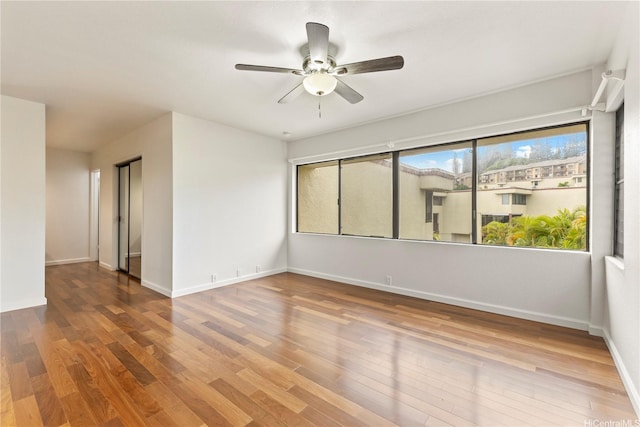 46-130 Kiowai St Unit 2724, Kaneohe, HI 96744 - empty room with baseboards, a ceiling fan, and wood finished floors