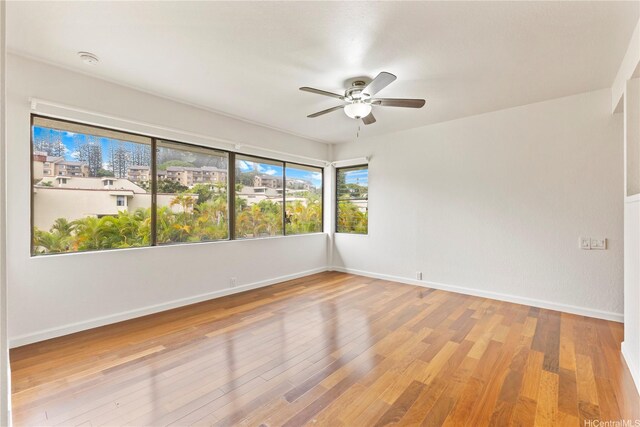 46-130 Kiowai St Unit 2724, Kaneohe, HI 96744 - empty room with baseboards, ceiling fan, and wood finished floors
