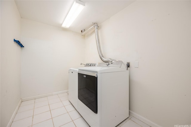 94-1081 Anania Cir Unit 12, Mililani, HI 96789 - laundry room featuring light tile patterned floors, baseboards, laundry area, and washer and dryer