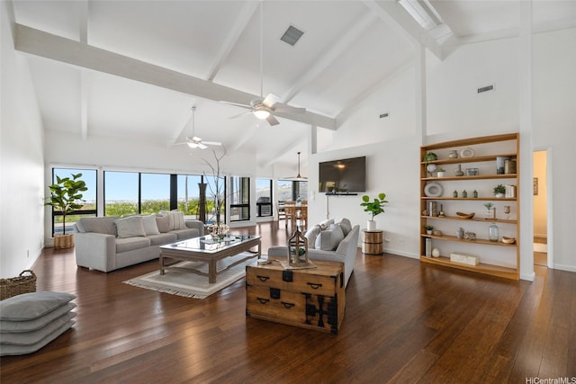 living area with visible vents, a ceiling fan, wood finished floors, and high vaulted ceiling