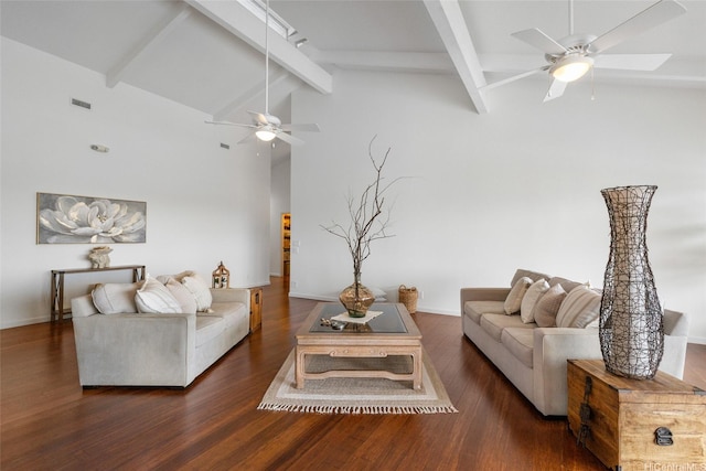 living room featuring visible vents, wood finished floors, baseboards, lofted ceiling with beams, and a ceiling fan