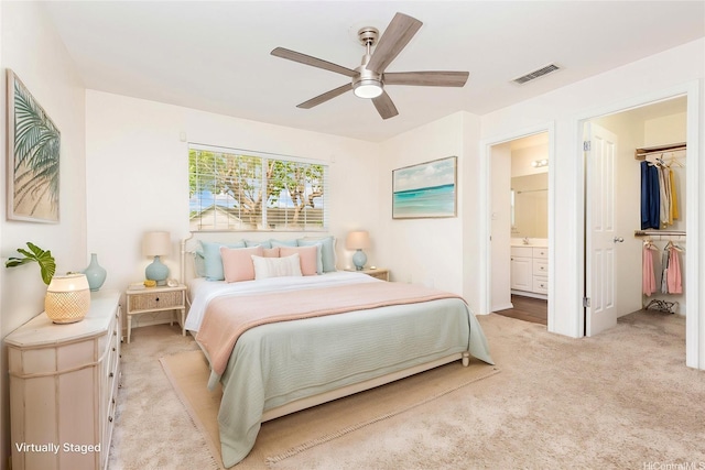 91-1031 Kaimalie St Unit 4B2, Ewa Beach, HI 96706 - bedroom with ensuite bath, ceiling fan, visible vents, a spacious closet, and light carpet