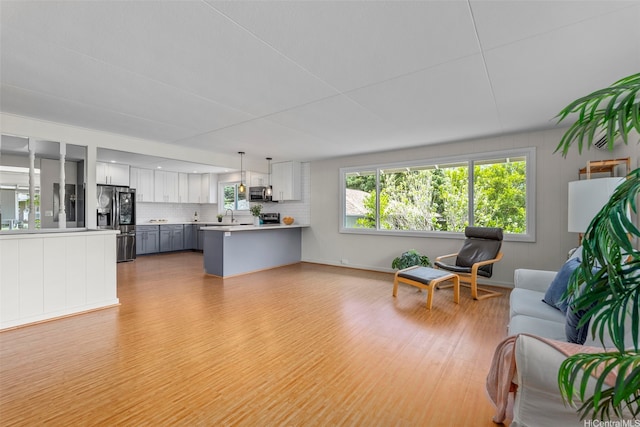 living room featuring light wood-style floors