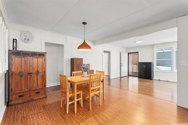 dining space featuring light wood finished floors