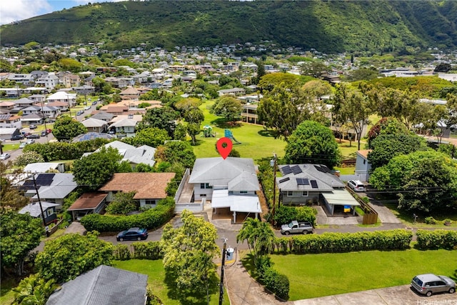aerial perspective of suburban area with a mountainous background