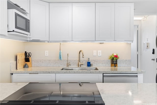 2611 Ala Wai Blvd Unit 1805, Honolulu, HI 96815 - kitchen featuring a sink, white cabinetry, dishwasher, and light stone counters
