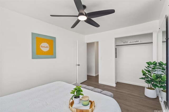 bedroom with baseboards, a ceiling fan, and wood finished floors