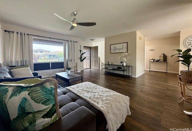 bedroom with baseboards, ceiling fan, and wood finished floors
