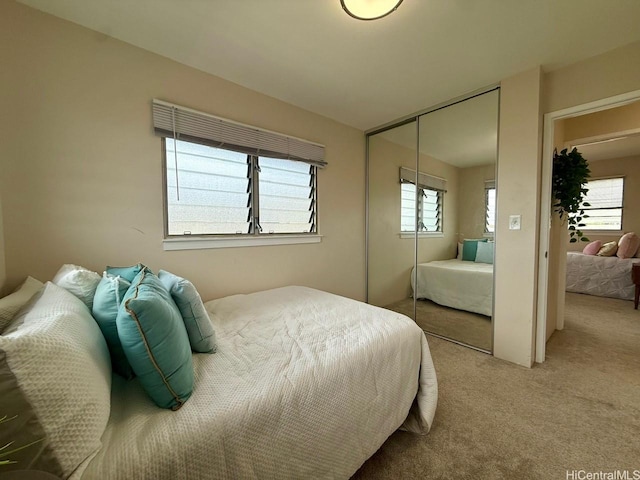 bedroom featuring a closet and carpet flooring