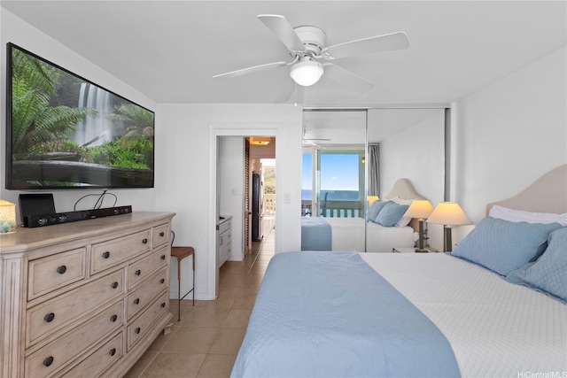 bedroom featuring light tile patterned floors and a ceiling fan