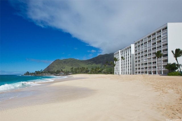 exterior space with a beach view and a water view