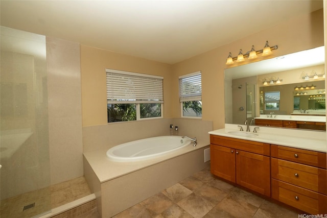 full bathroom with a walk in shower, a bath, and vanity