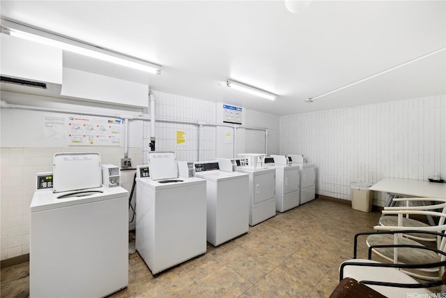 common laundry area with washing machine and clothes dryer