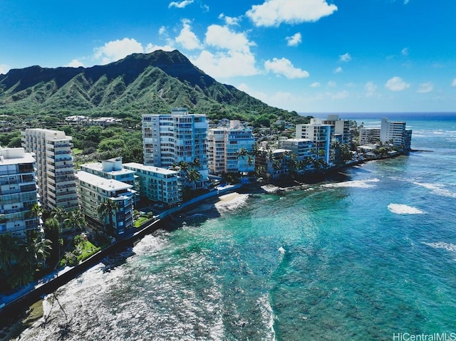 drone / aerial view with a view of city and a water and mountain view