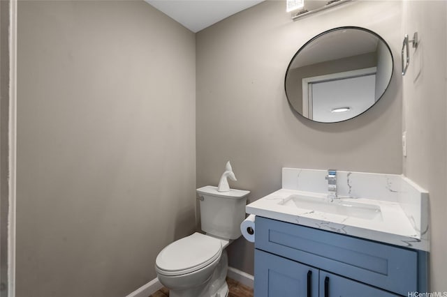 45-008 Mahalani Cir, Kaneohe, HI 96744 - half bath with toilet, baseboards, wood finished floors, and vanity