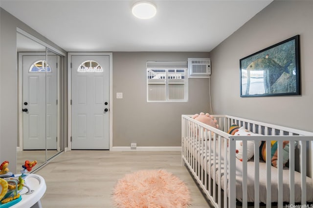 45-008 Mahalani Cir, Kaneohe, HI 96744 - entryway with baseboards, a wall mounted air conditioner, plenty of natural light, and wood finished floors