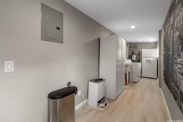 45-008 Mahalani Cir, Kaneohe, HI 96744 - hallway featuring washer / dryer, electric panel, light wood-style flooring, and electric water heater