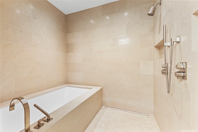 bathroom featuring tiled shower