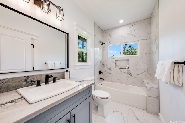 bathroom with vanity, toilet, marble finish floor, recessed lighting, and shower / washtub combination
