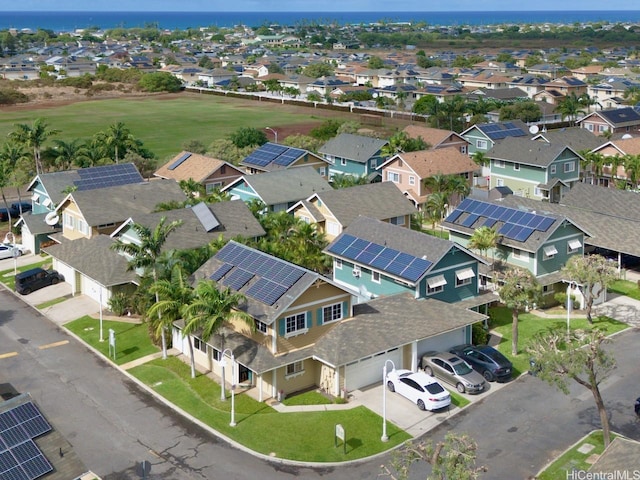 drone / aerial view featuring a residential view and a water view