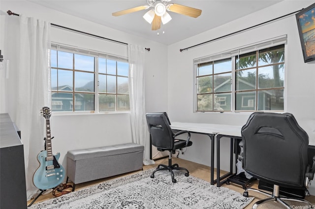 office area with a ceiling fan