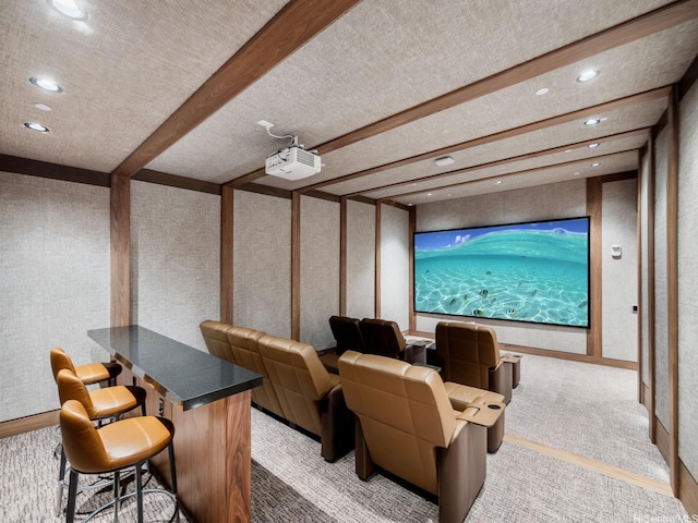 carpeted cinema with a textured ceiling, beamed ceiling, and recessed lighting