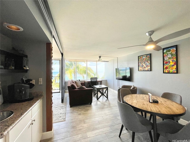 68-121 Au St Unit 403, Waialua, HI 96791 - dining area with light wood-type flooring and ceiling fan