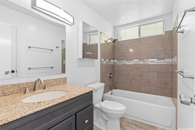 full bathroom with shower / bath combination, vanity, and toilet