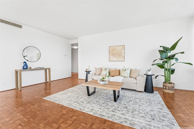 4340 Pahoa Ave Unit 19D, Honolulu, HI 96816 - living room featuring a textured ceiling