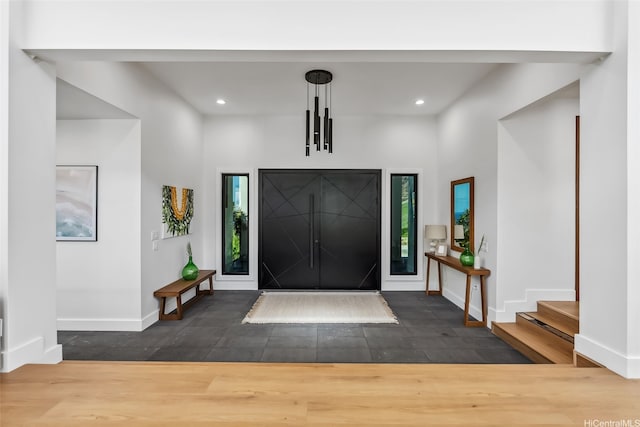 foyer entrance featuring recessed lighting, baseboards, and wood finished floors
