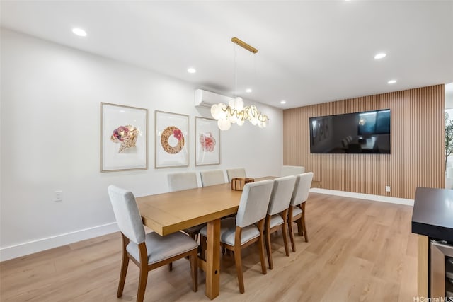 dining room featuring light wood-style floors, baseboards, and recessed lighting