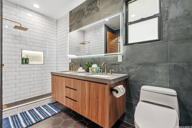 bathroom with a walk in shower, toilet, tile walls, and a sink