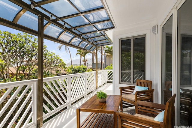 balcony featuring a sunroom