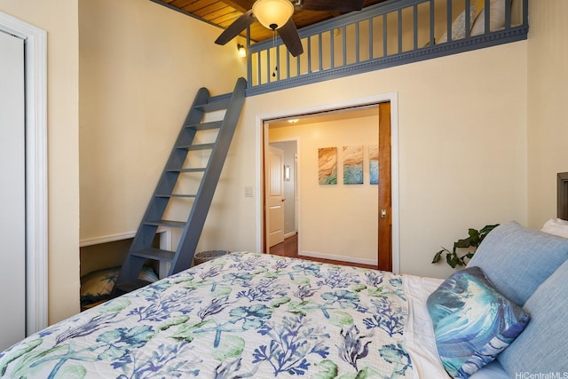 bedroom with ceiling fan and wooden ceiling