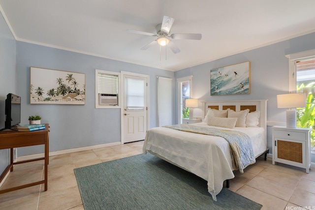 bedroom featuring light tile patterned floors, baseboards, and ceiling fan