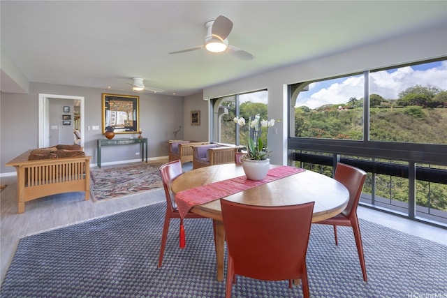 1022 Prospect St Unit 903E, Honolulu, HI 96822 - dining room featuring wood finished floors, a ceiling fan, and baseboards