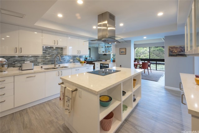 1022 Prospect St Unit 903E, Honolulu, HI 96822 - kitchen with a sink, island range hood, open shelves, a raised ceiling, and recessed lighting