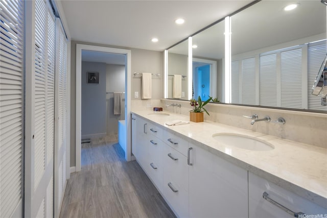 1022 Prospect St Unit 903E, Honolulu, HI 96822 - full bath with a closet, wood finished floors, baseboards, double vanity, and recessed lighting