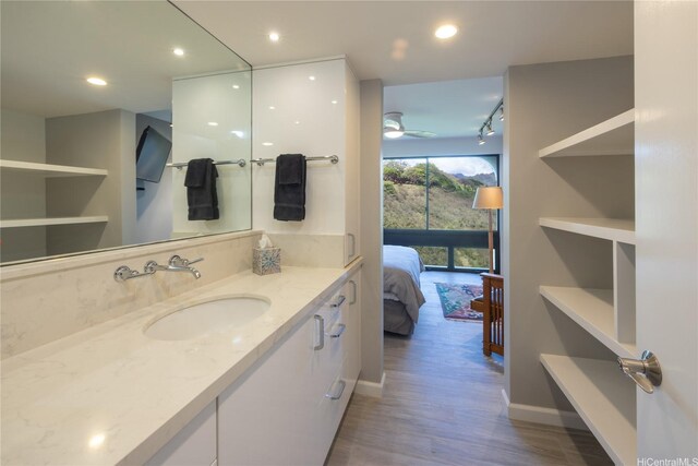 1022 Prospect St Unit 903E, Honolulu, HI 96822 - ensuite bathroom featuring wood finished floors, vanity, recessed lighting, and baseboards